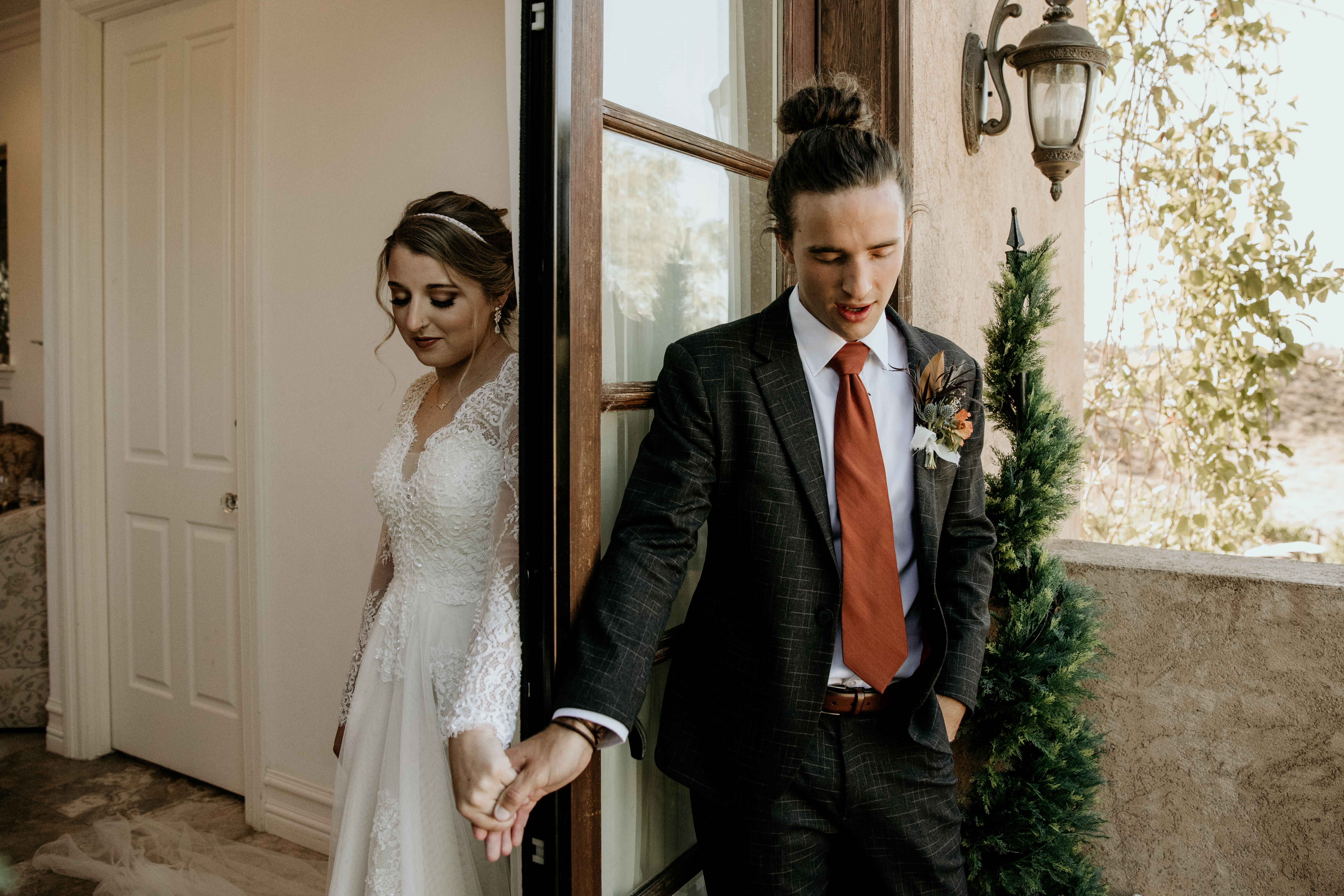 bride and groom holding hands