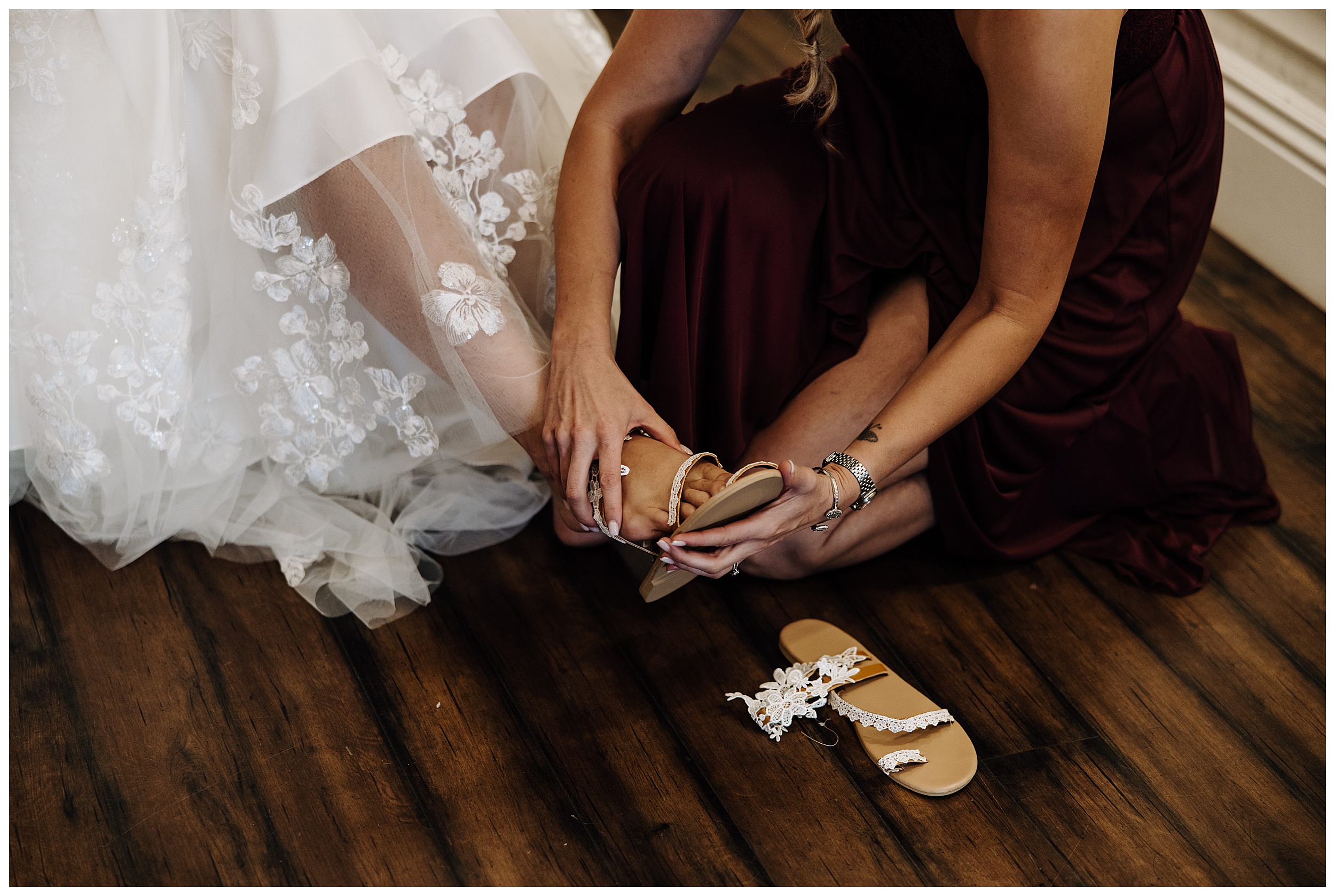 bride putting shoes on