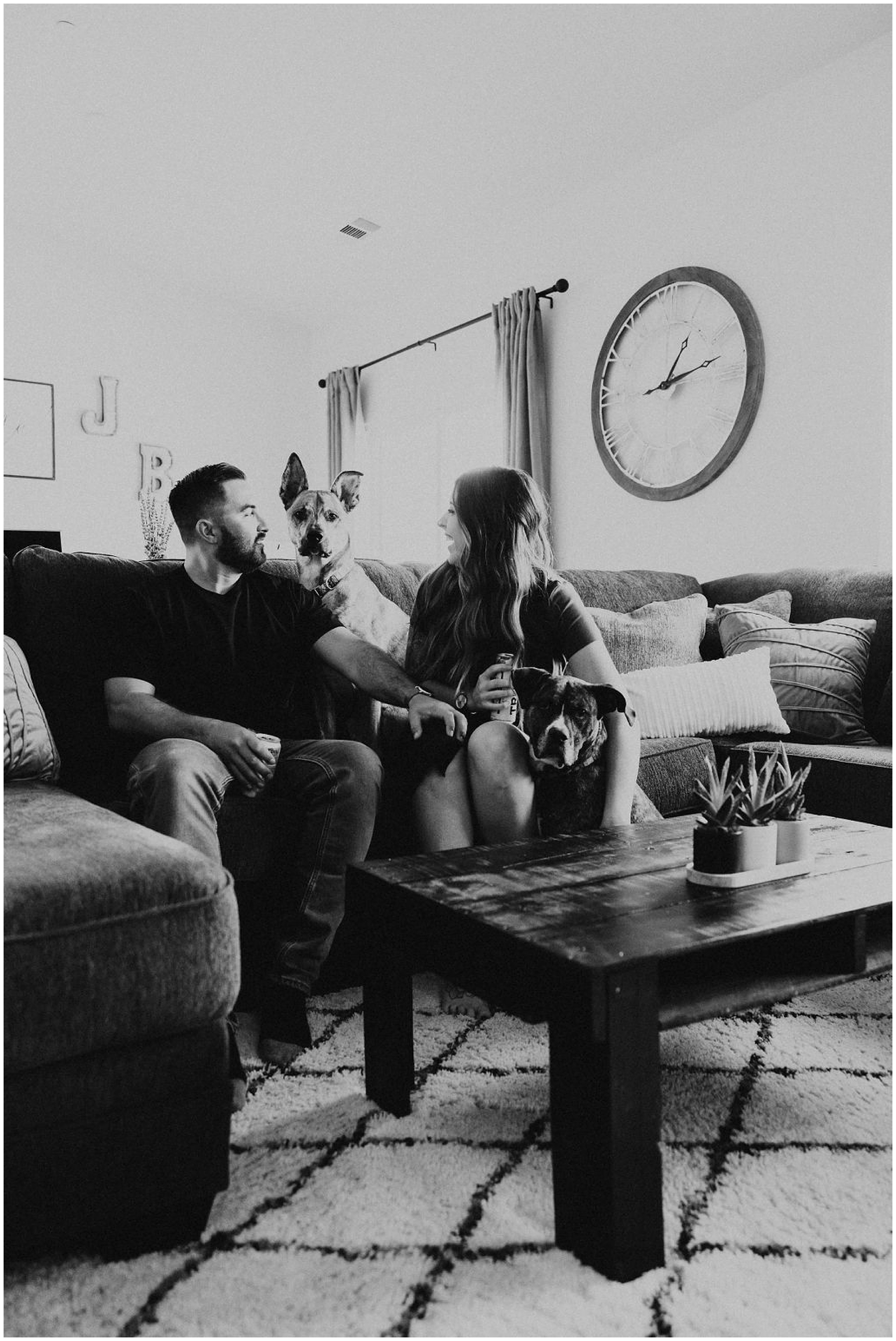 couple on couch with dogs