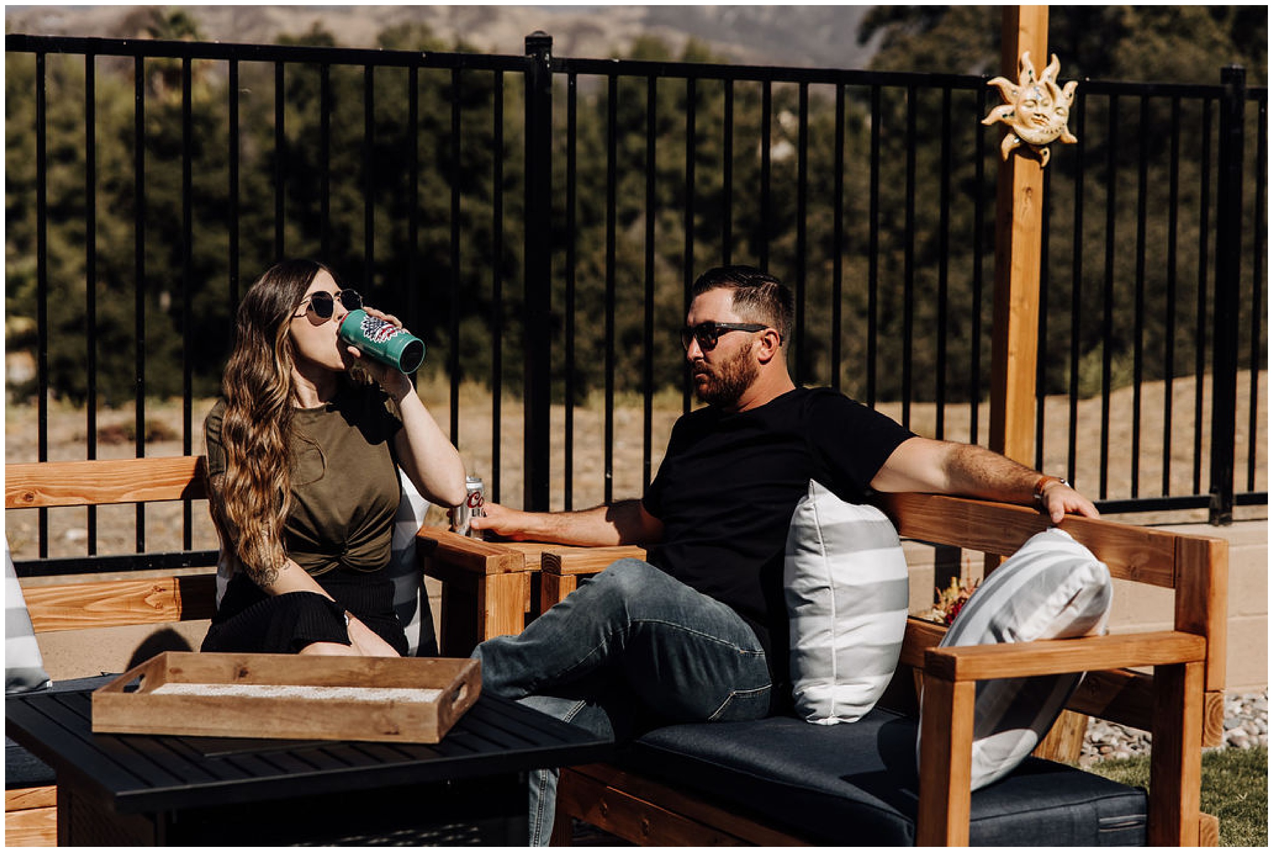couple drinking on porch outside