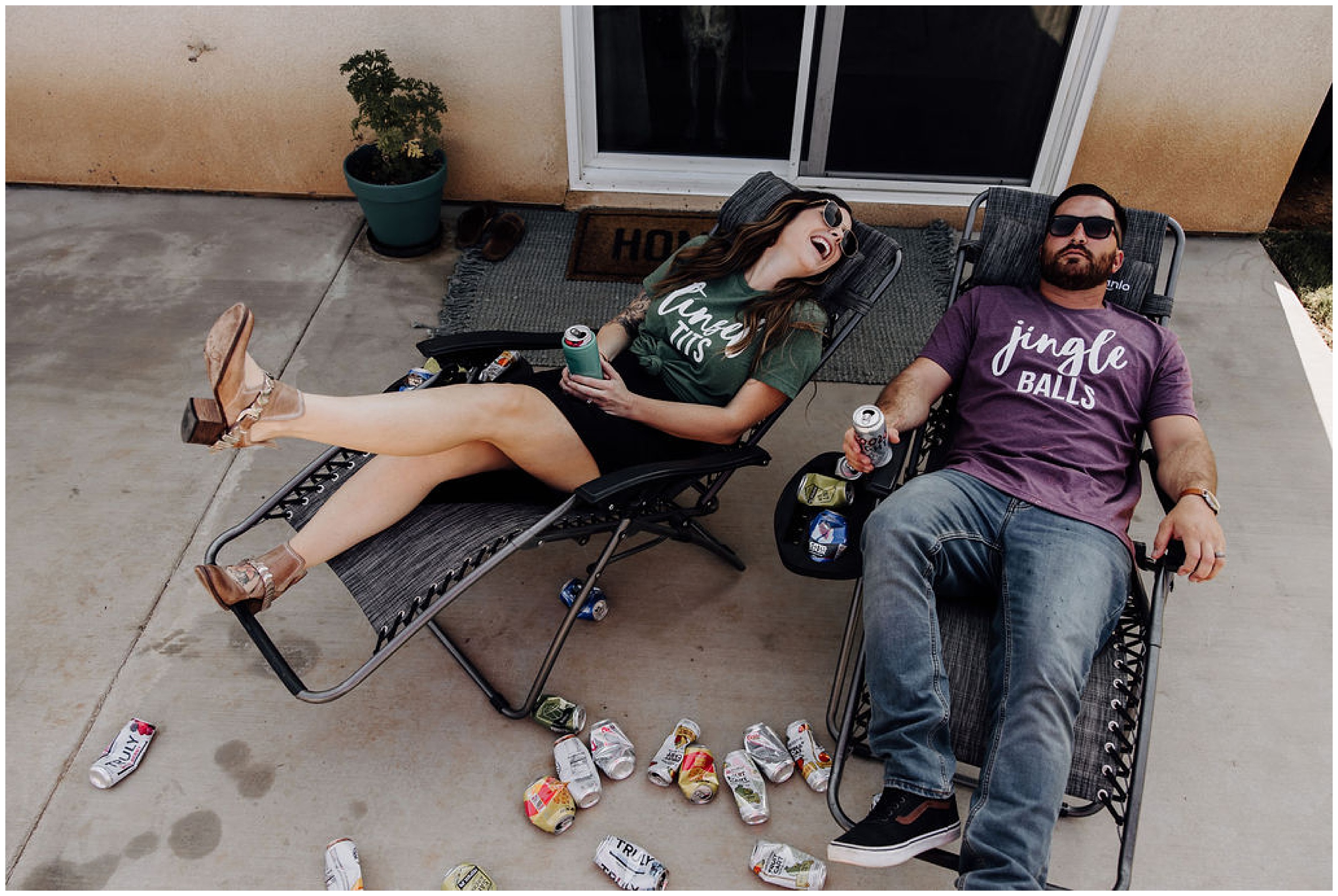 couple sitting on porch outside and laughing