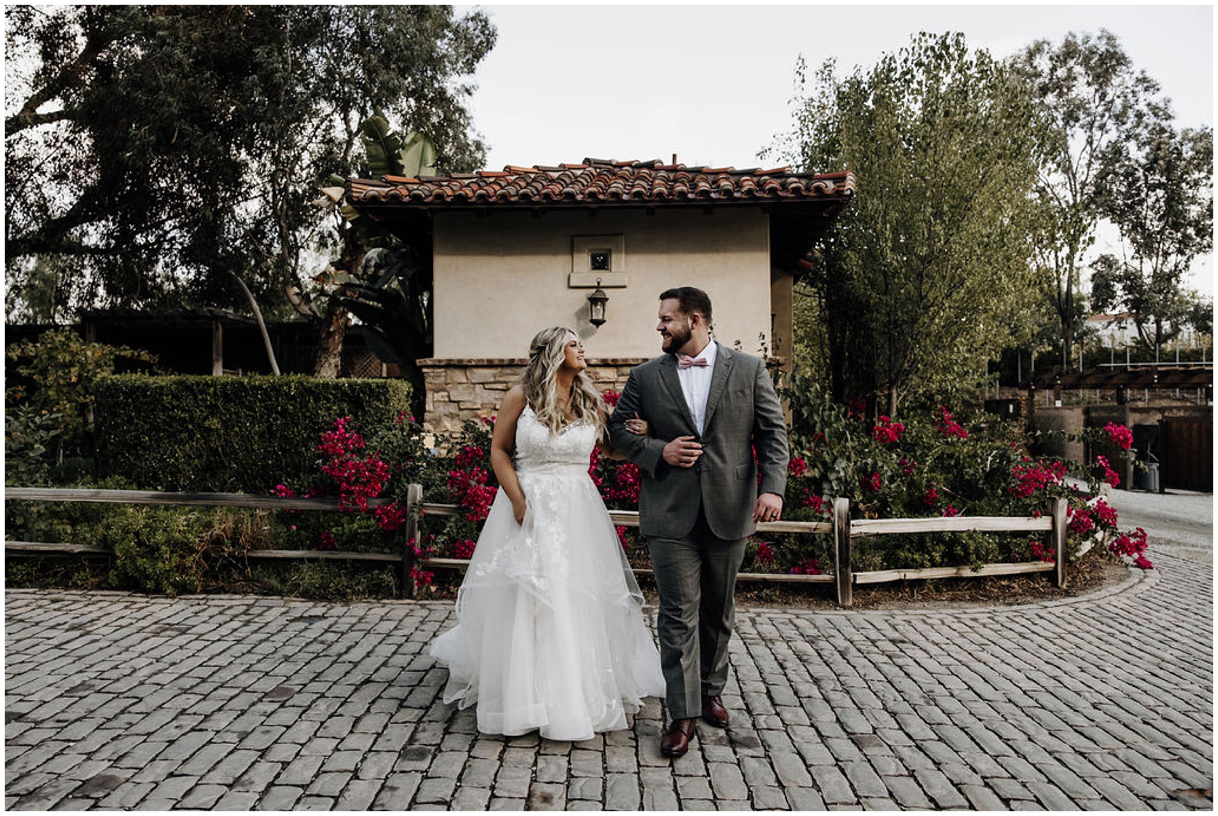 bride and groom holding hands and walking
