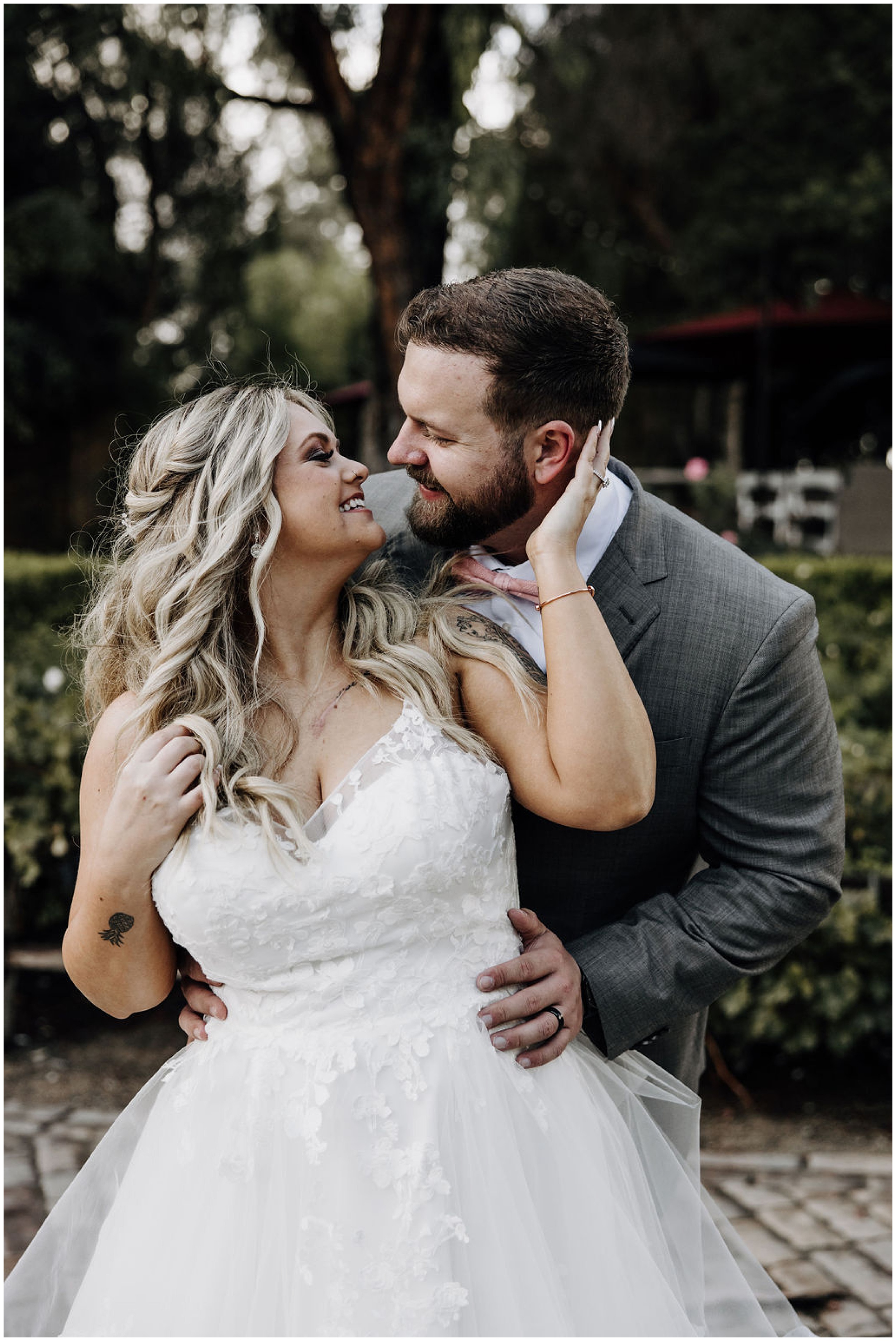 bride and groom kissing and smiling
