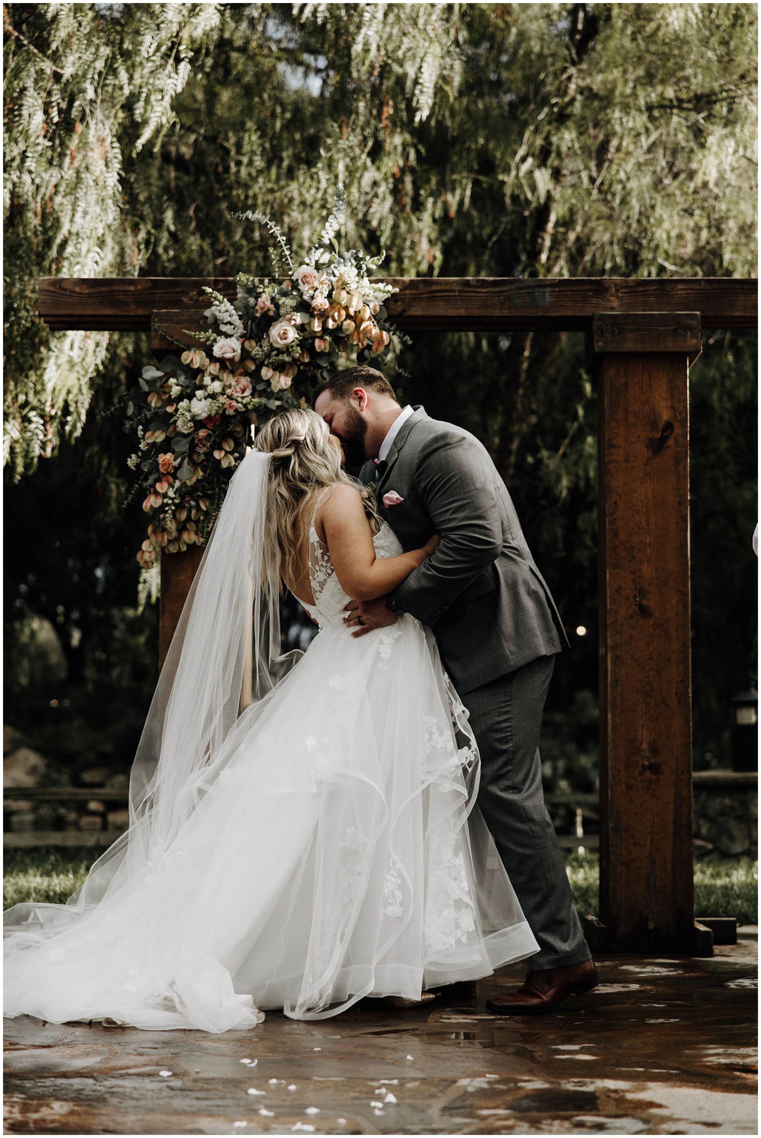 bride and groom first kiss