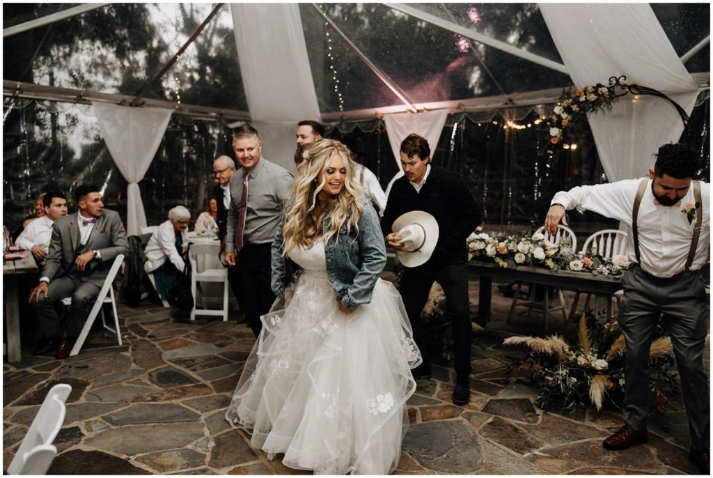 bride dancing with wedding guests