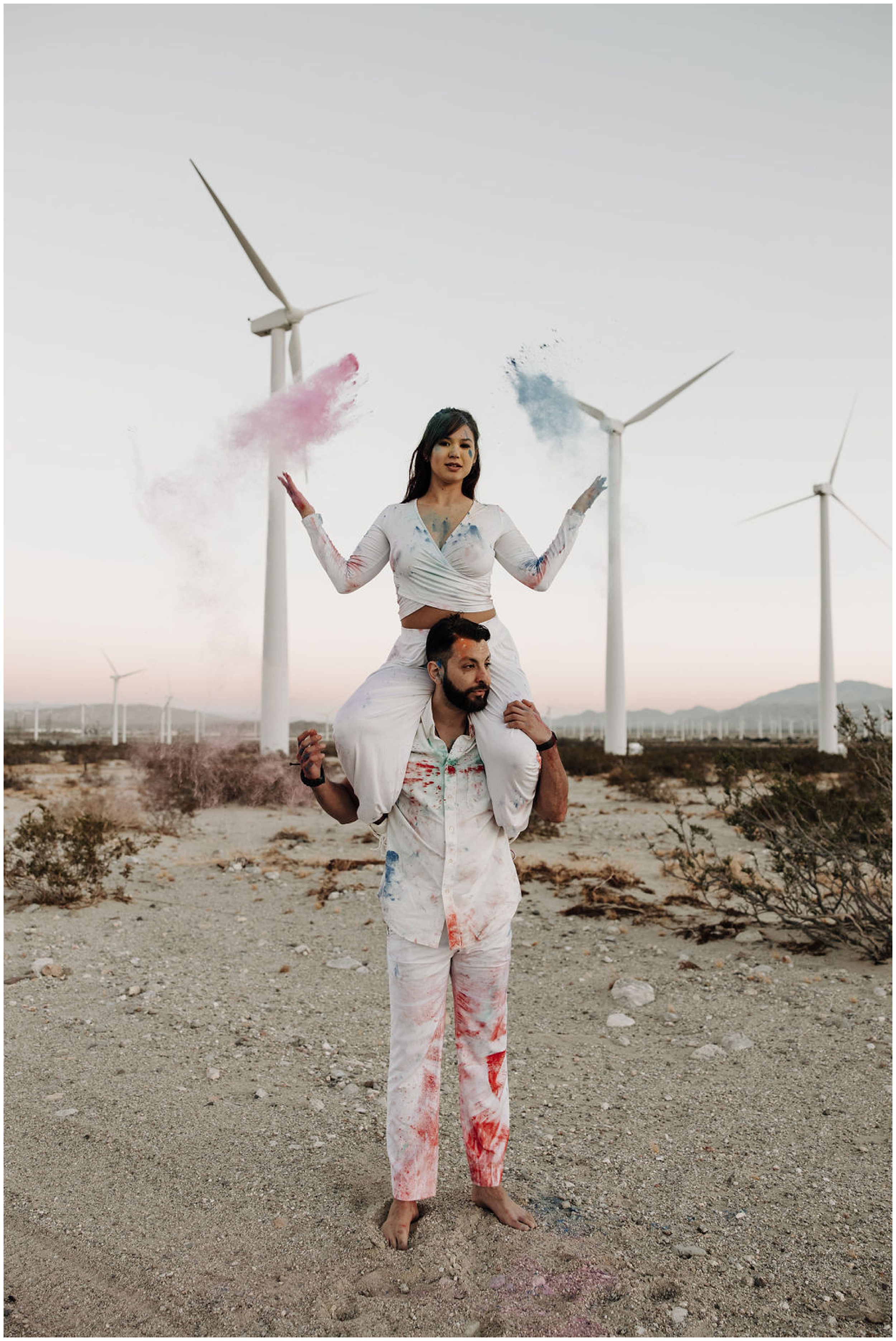 couple playing with color powder
