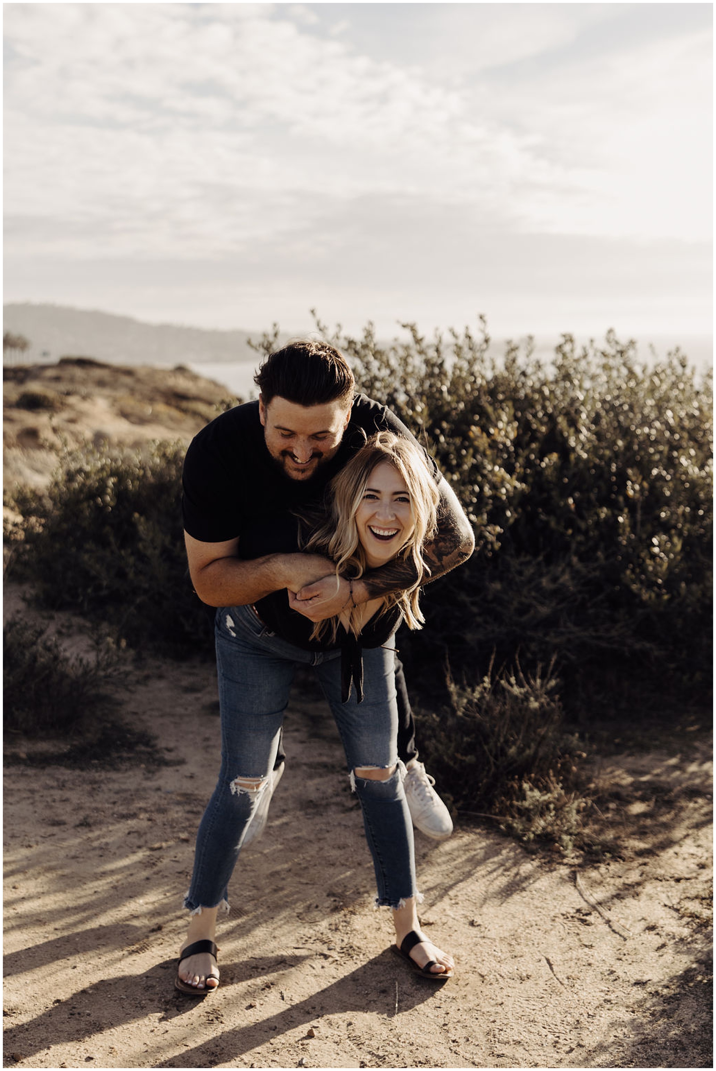 woman giving man a piggy back ride