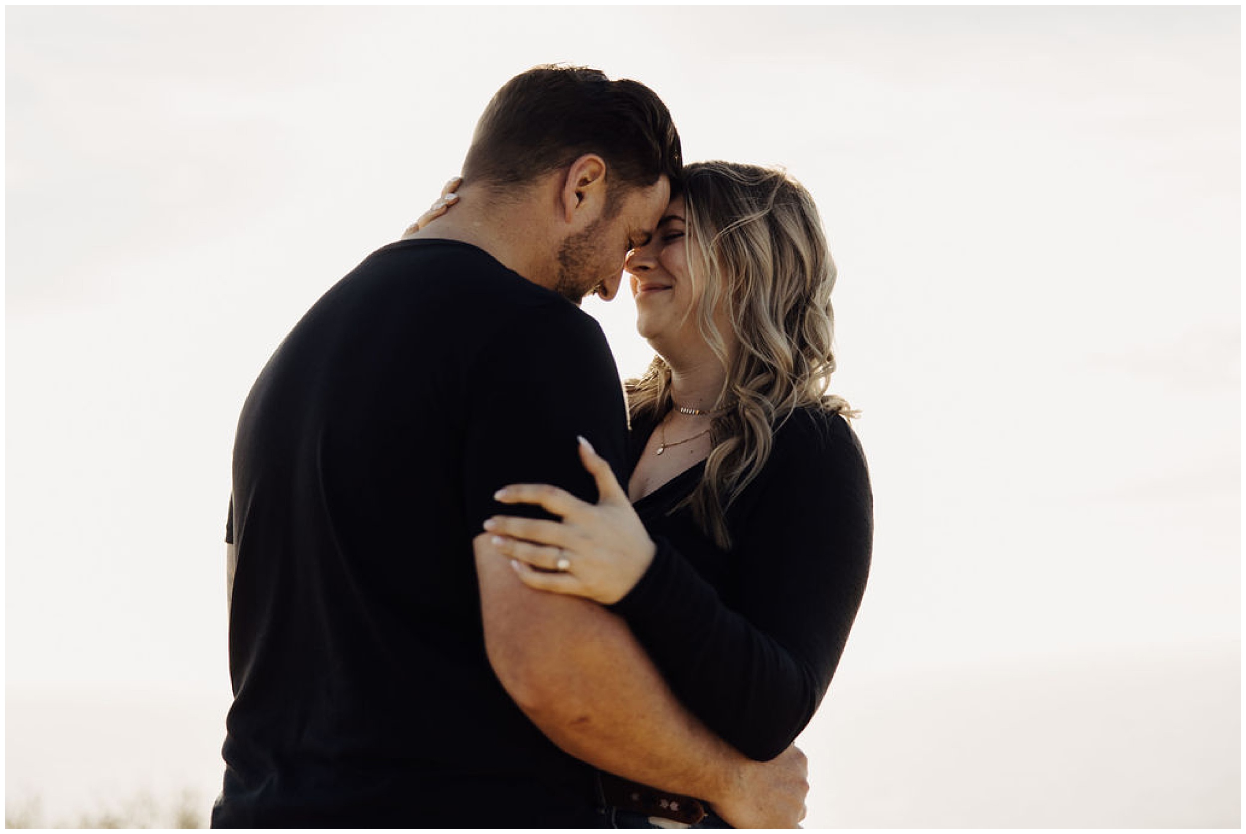 couple leaning foreheads together