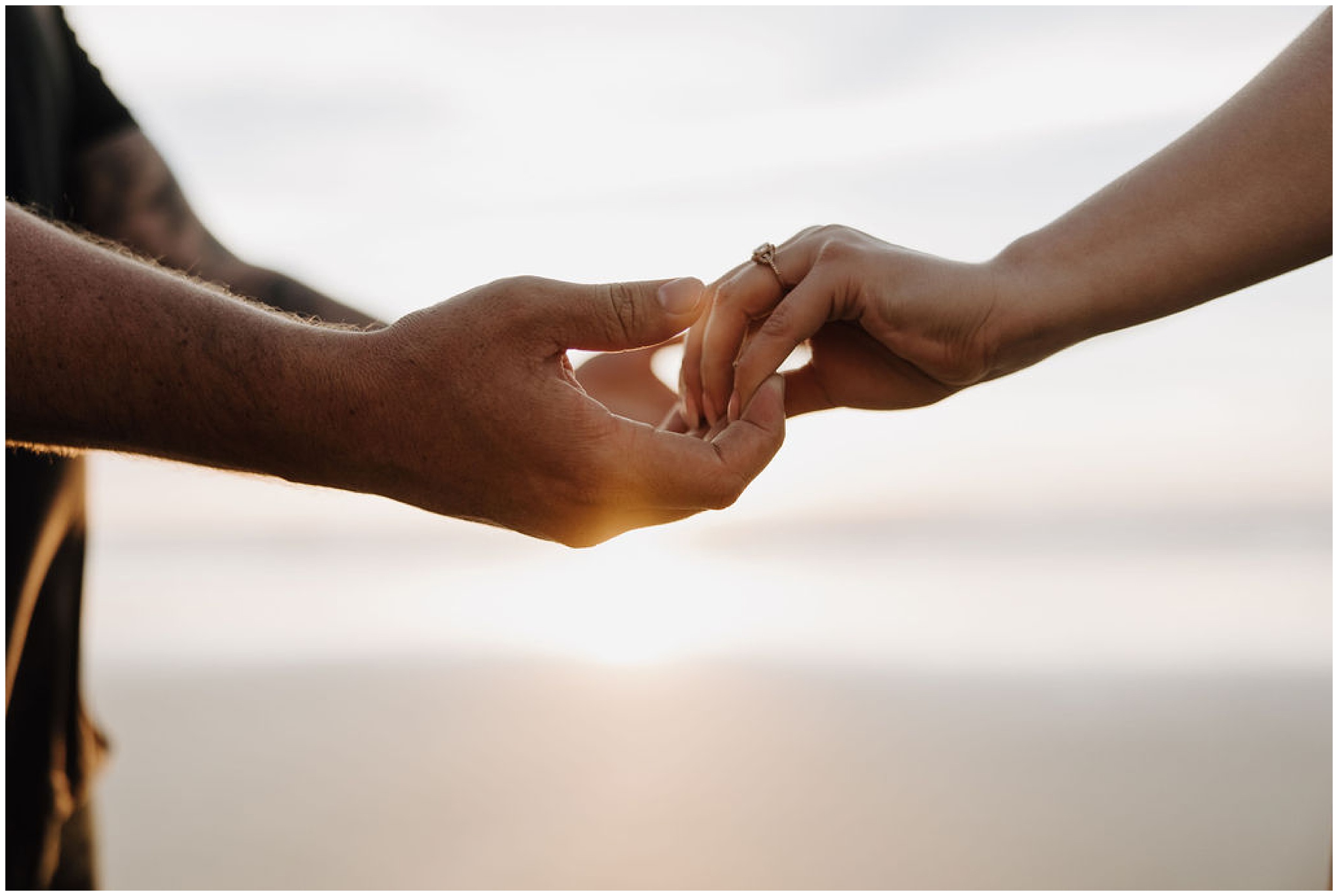 holding hands in sunlight