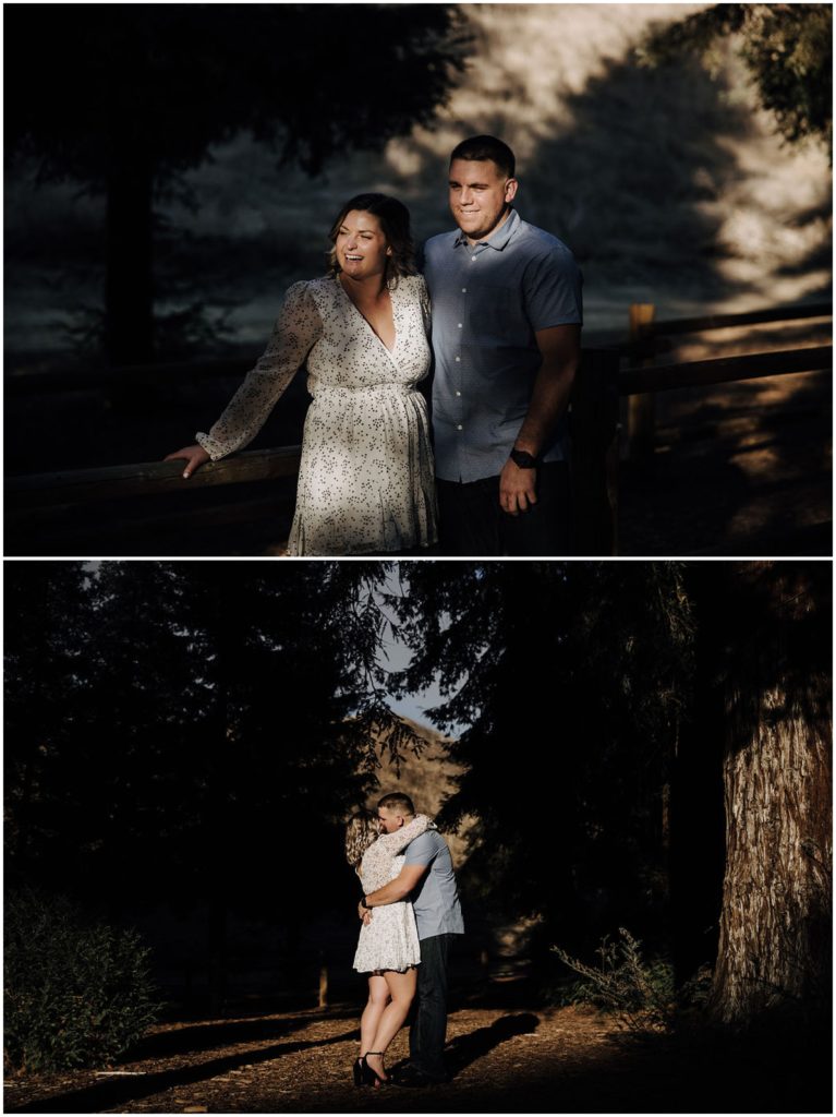 couple kissing under trees