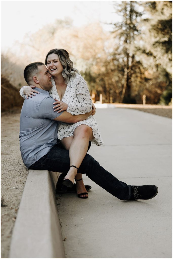 woman sitting on man's lap