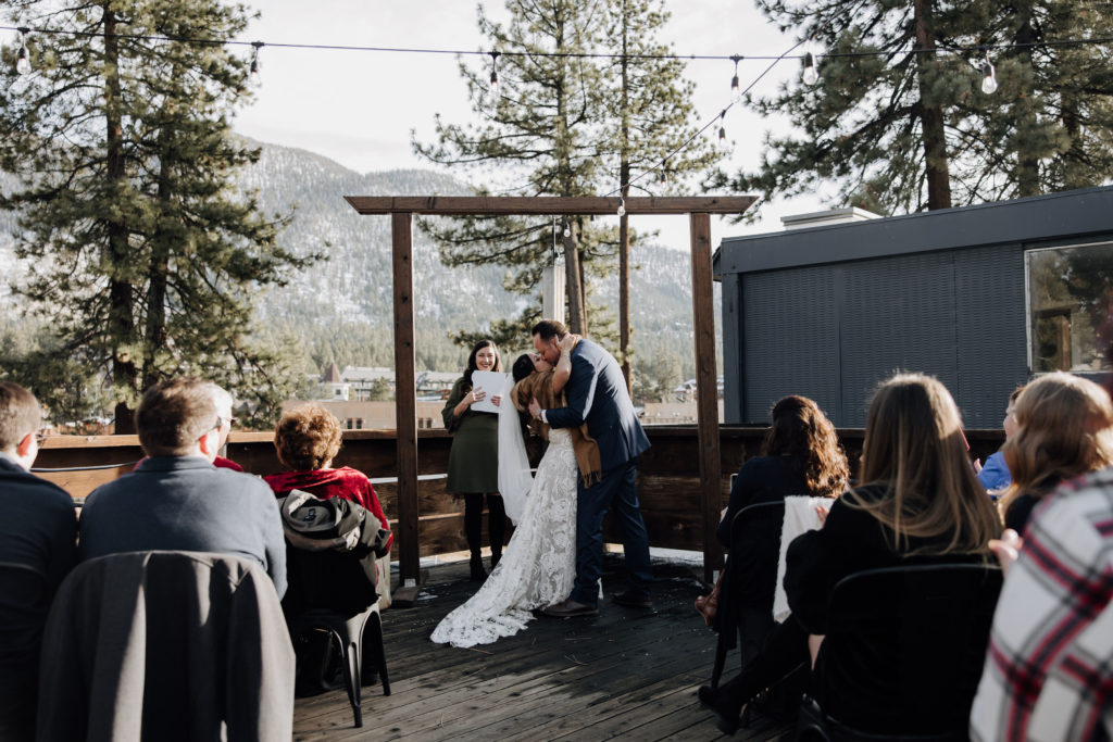 bride and groom first kiss
