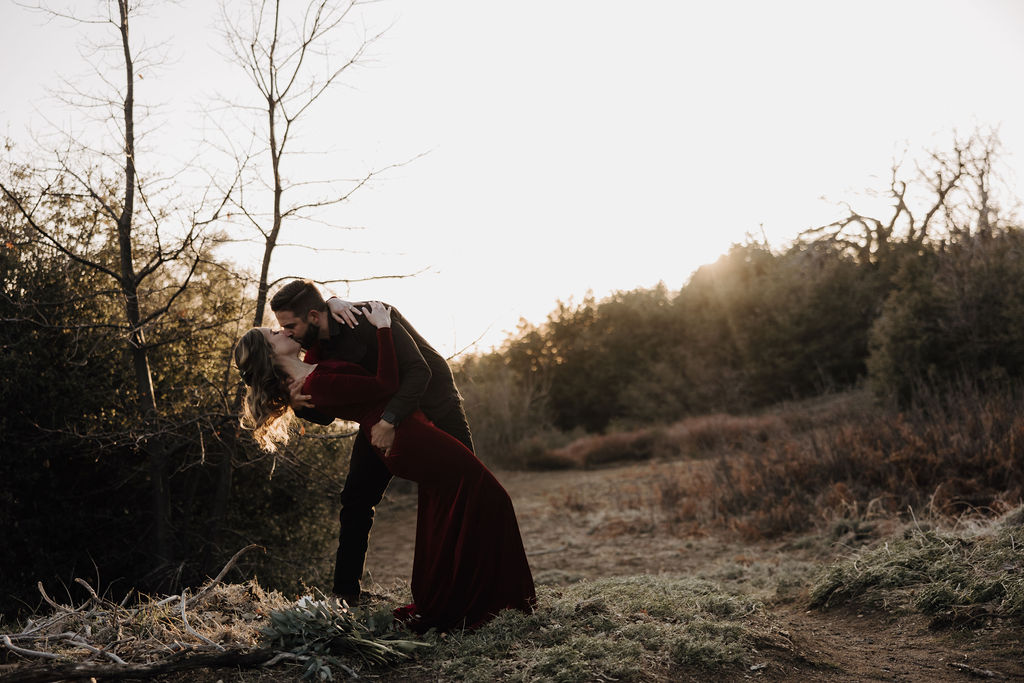 man dipping woman for kiss