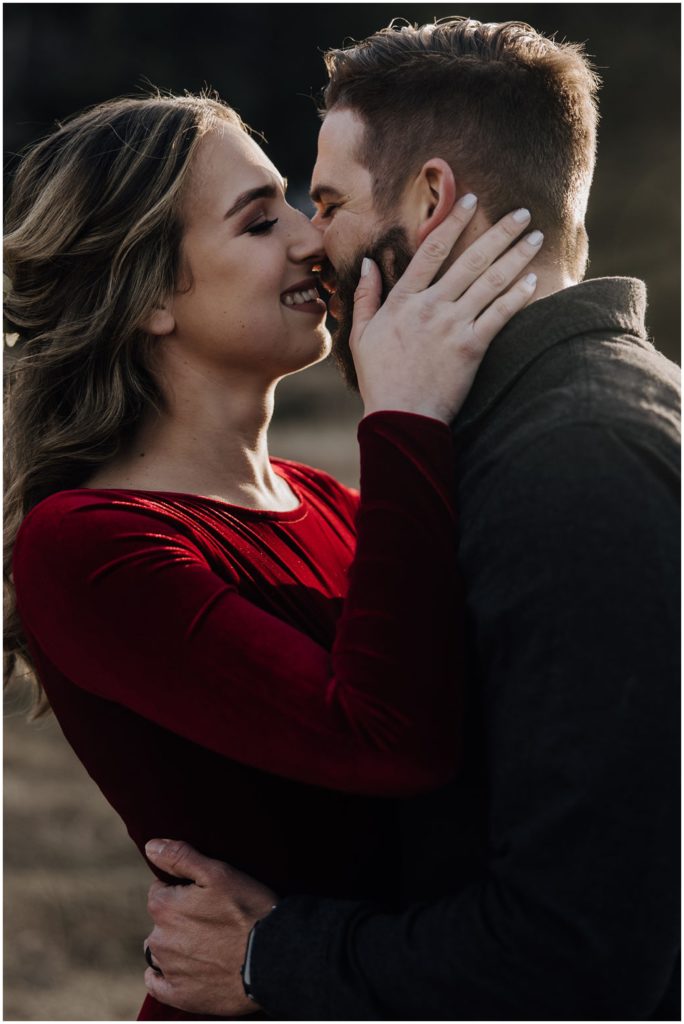 couple kissing and smiling