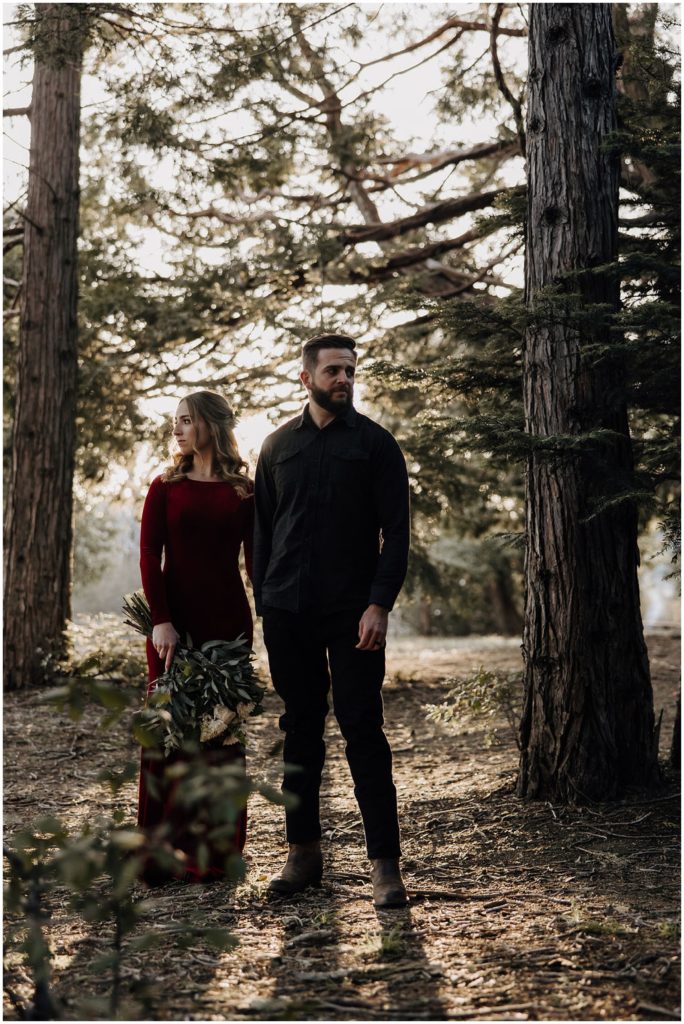 couple standing in trees
