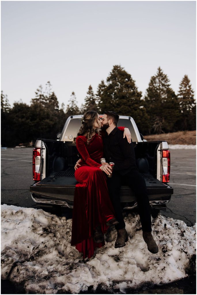 couple sitting on truck bed