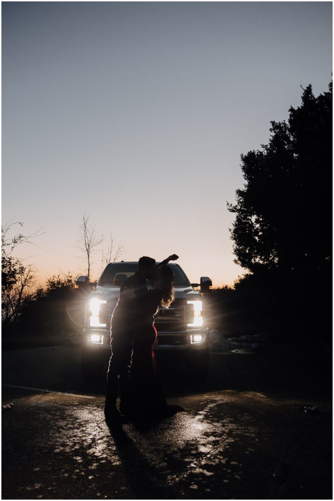 couple in front of car