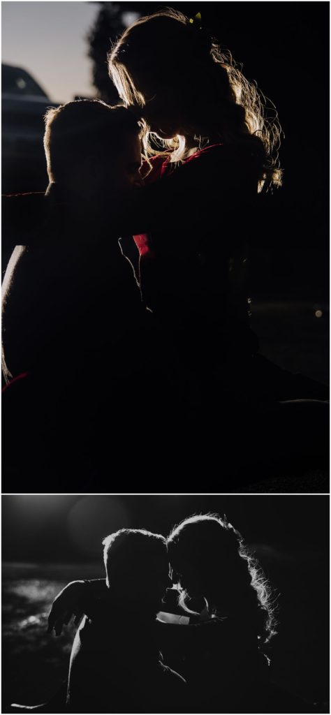 couple kissing in car headlights