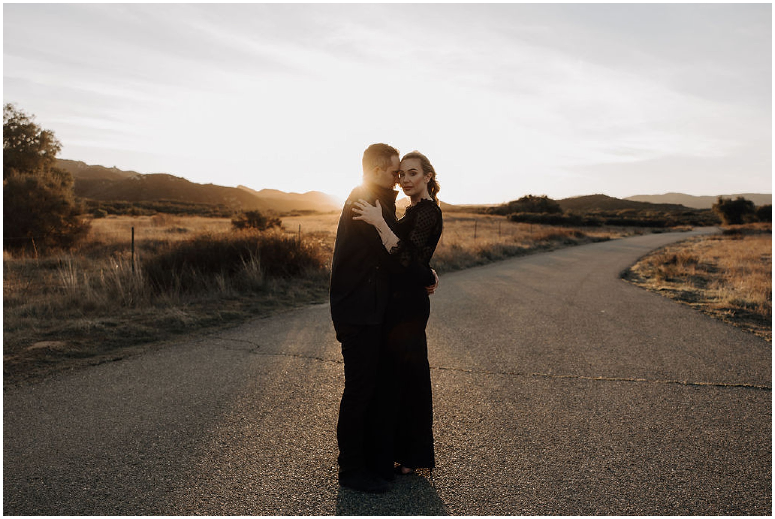 couple standing at sunset