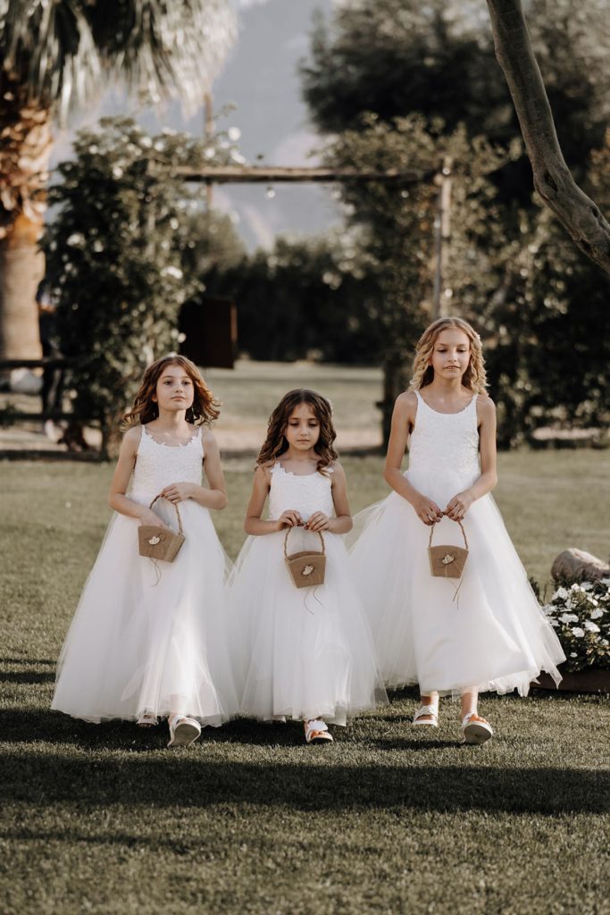 flower girls walking down aisle
