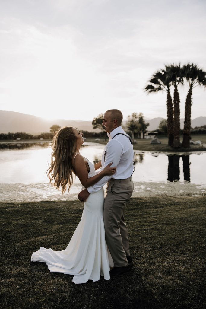bride and groom embracing