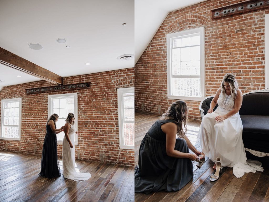 brides mom helping her into her gown
