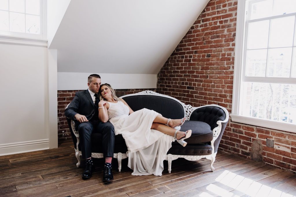 bride and groom sitting on sofa